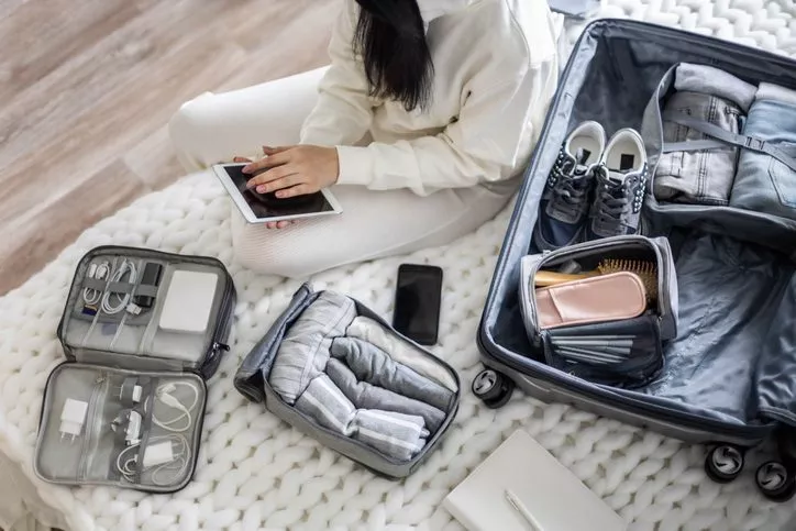 woman packing suitcase