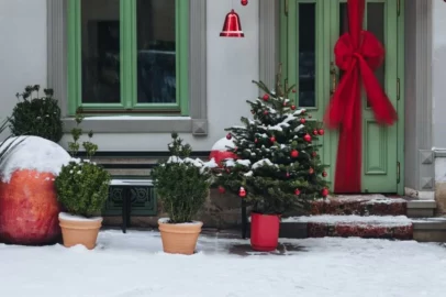 A well-decorated front door in the winter.