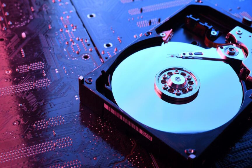 A hard disk drive with the case opened to expose the interior. 