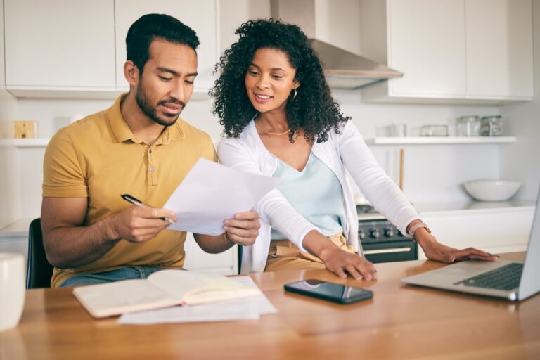 A couple looks over their records as they file their tax returns.